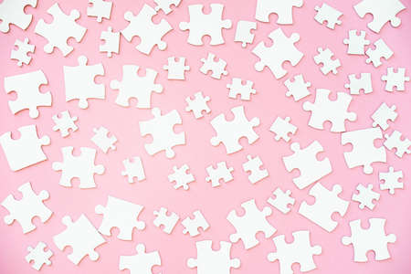 White puzzle pieces of different sizeの写真素材