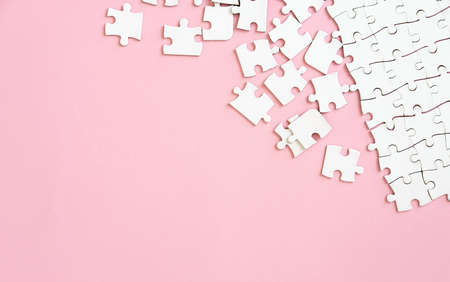 Puzzle pieces on pink backgroundの写真素材