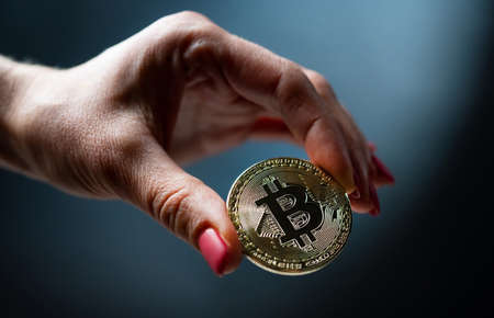 Hand holding bitcoin