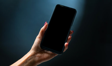 Hand holding smartphoneの写真素材