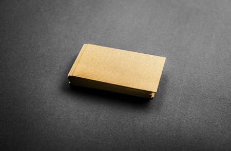 Blank golden business card on grey backgroundの写真素材