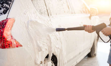 Pressure foam sprayer on car washの写真素材