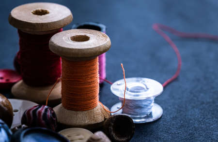 Bobbins of threads near buttonsの写真素材