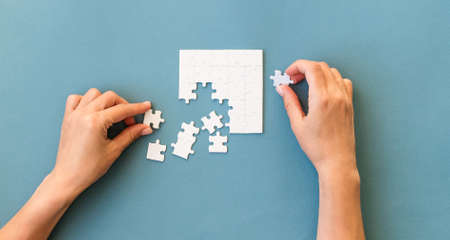 Hands with Small white square puzzle