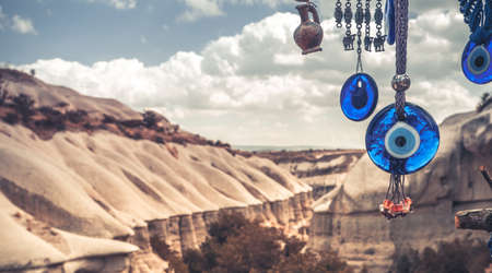 Evil eye amulets on mountains backgroundの写真素材