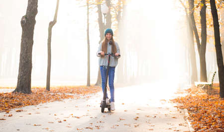 Cute girl on scooterの写真素材