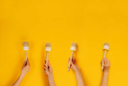 Hands holding paint brushの写真素材