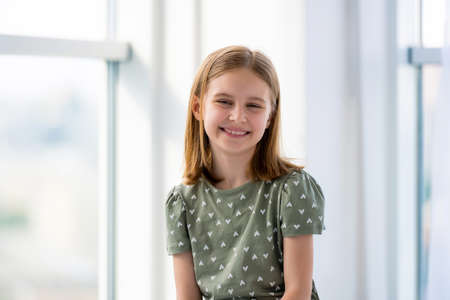 Portrait of preteen girl indoors