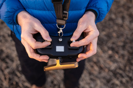 Person holding remote controller