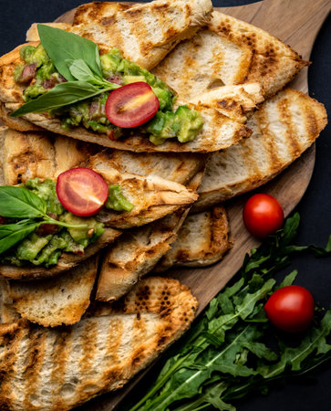 Bruschettas with guacamole and cherry tomatoes