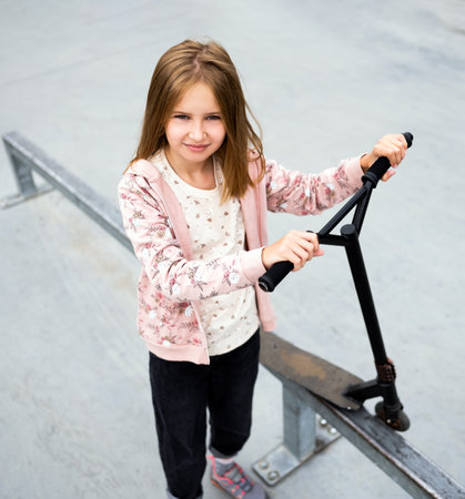 Girl with scooterの写真素材