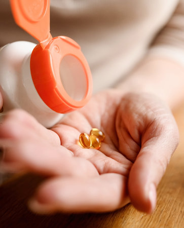 Girl take pills with dietary supplement and vitamins.の写真素材