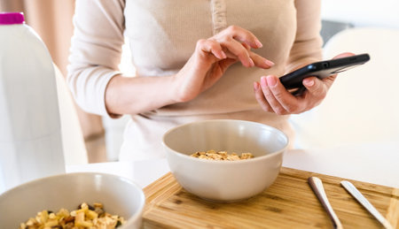 Girl preparing morning breakfast with oatmeal