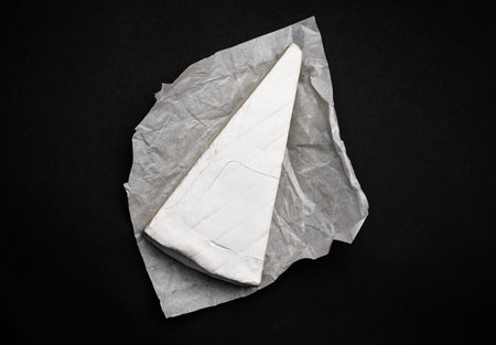 Creame cheese brie on black background. French delicatessen for gourment and healthy nutritionの写真素材