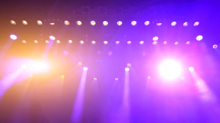 glowing purple atmospheric abstract background of concert spotlights with light and Mist during the show or concertの写真素材