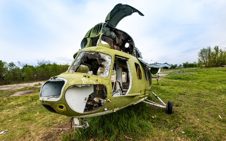 Abandoned soviet union helicopter with camouflage color cabin at the airfieldの写真素材