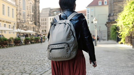 Girl Tourist, With Backpack, Explores Historical Part Of European City, Admiring Landmarks