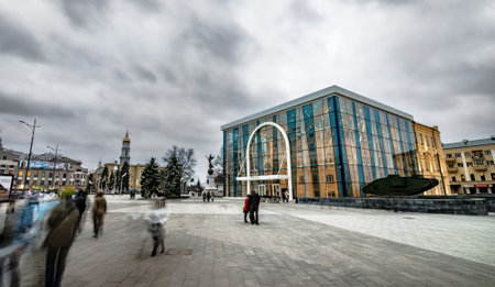 Kharkiv, Ukraine - 01 December 2013: People walking in the center of the city. Historical museum and...