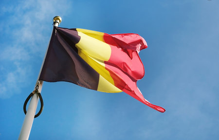 National Belgium Flag Waving Against The Sky Background On A Poleの写真素材