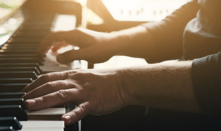 Man hands playing piano keyboard closeup and creating instrumental composition with professional sound. Musician perfomance with classical music on pianoforteの写真素材