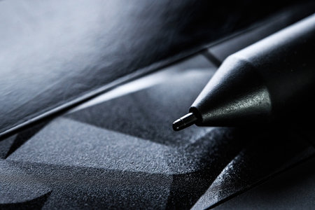 drawing pen on a tablet close up view