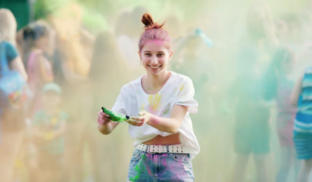 Girl Tossing Vibrant Holi Powder Paint During Holi Festival