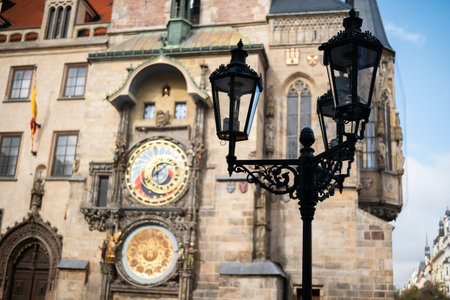 Hall Tower With An Astronomical Clock Stands On A Market Square In Prague Against A Blue Sky