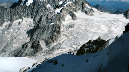 Group Of Climbers Climbing The Montblanc Snowy Mountainの写真素材