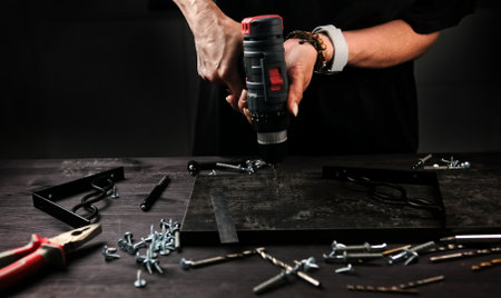 Girl Carpenter Drills A Wooden Plank In A Workshop, Making Stylish Home Shelves