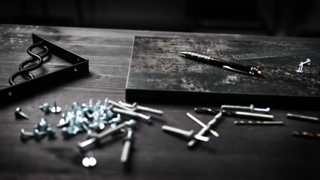 Carpenter Tools And Screws On A Table With Particle Board Serving As A Shelfの写真素材