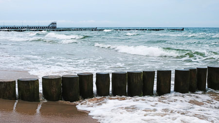 Waves Running Around The Wooden Groynes As They Create An Amazing Landscape At The Baltic Seaの写真素材