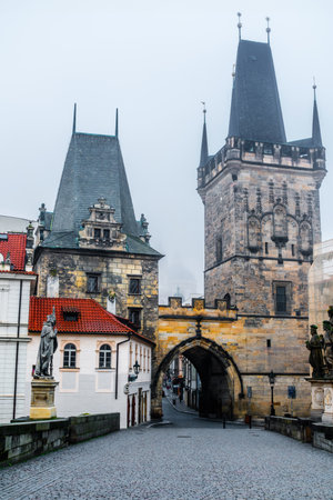 Mysterious Charles Bridge In Prague With Mala Strana Bridge Tower Through A Light Fogの写真素材