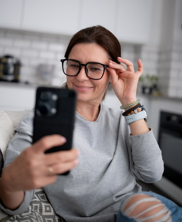 Happy Girl Taking A Selfie With A Smartphone Or Having An Online Video Chatの写真素材