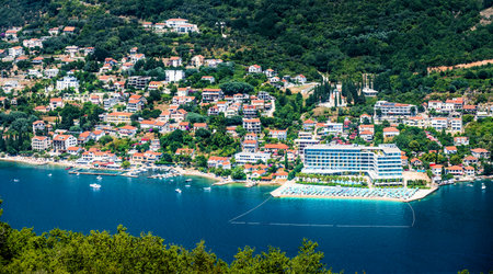 Mediterranean city and Kotor bay scenic view in Montenegro from above. Amazing aerial panorama on Adriatic sea and luxury hotel resort with beachの写真素材