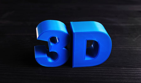Plastic 3D Three-Dimensional Letters Printed With Home 3D Printer On A Table , Concept Of 3D Printingの写真素材