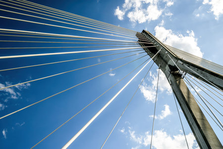 ropes of big metal Bridge against Blue Skyの写真素材