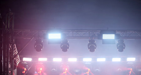 Spotlights Illuminate The Concert Stage During A Light Showの写真素材