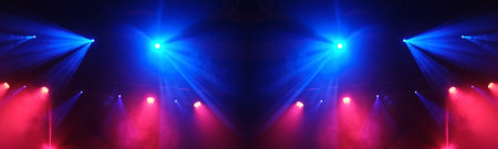 Stage Light Illuminates The Concert Stage With Smoke During A Musical Performance
