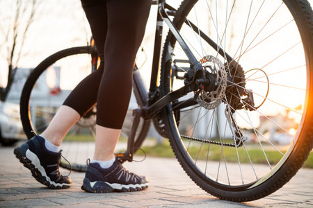 Girl's Legs With Mountain Bike In Park On A Bike Rideの写真素材