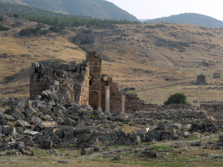 The ruins of an ancient Greek city in the background of hills and green cypresses. Turkeyの写真素材