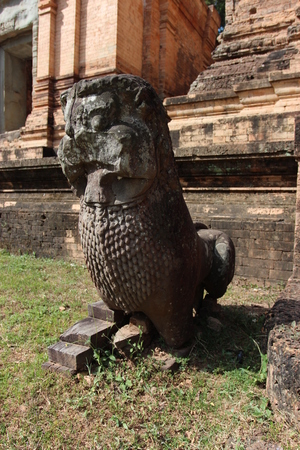 Sculpture on the ruins of a ruined temple in Angkor complex, near the ancient capital of Cambodia - Siem Reapの写真素材