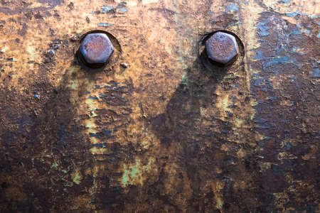 Old flange on the mechanism with the rusted bolts and old paint.の写真素材