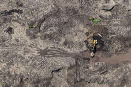 Aerial view of diging lignite on surface mining, environmental disaster