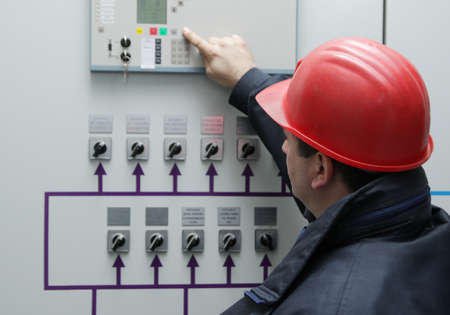 Engineer give command in power plant control center