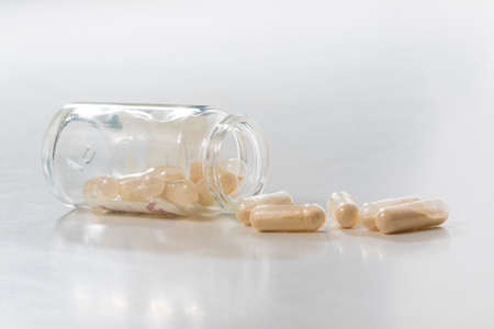 Yellow transparent  Probiotics  capsule in glass bottleの写真素材