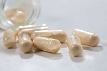 Closeup of transparent  Antibioticss  capsule in glass bottle