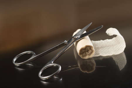 Scissors and bandage, First aid kit on tableの写真素材