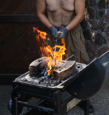Man Preparing a fire  for  barbecueの写真素材