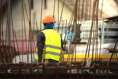 Builder in orange helmet at the construction siteの写真素材