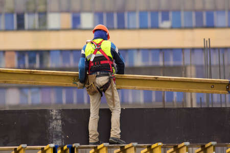 Worker build scaffolding at the construction  site の写真素材
